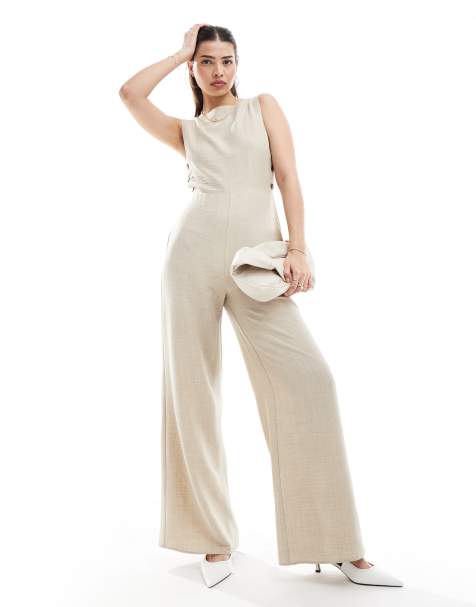ASOS DESIGN – Hochgeschlossener Jumpsuit in Sand mit weitem Bein und seitlichen Knöpfen - view 1