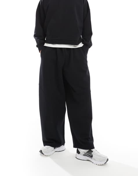 ASOS DESIGN – Hochwertige, schwere Jogginghose in Schwarz mit lockerem Schnitt und Nahtdetail, Kombiteil - view 1