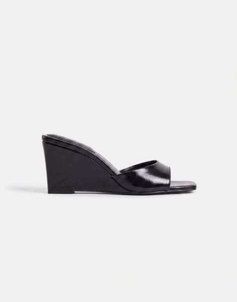 ASOS DESIGN Hola mid wedge mules in black - view 1