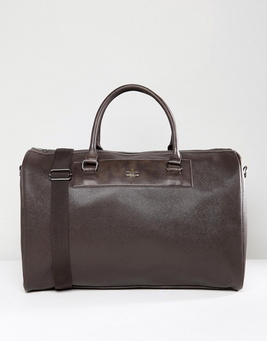 ASOS DESIGN holdall bag in brown faux leather with gold branded emboss