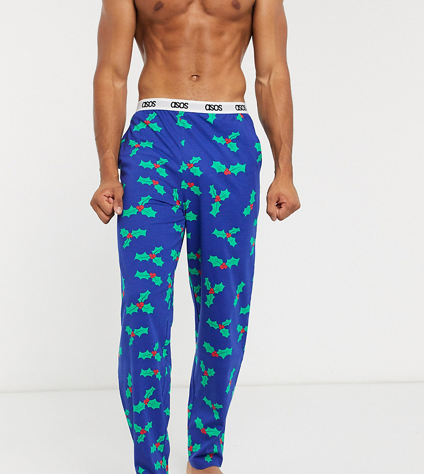 ASOS DESIGN Holidays lounge pyjama bottoms with holly print and branded waistband-Navy