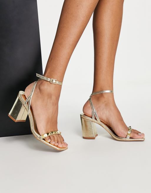 ASOS DESIGN Holt studded mid heeled sandals in gold