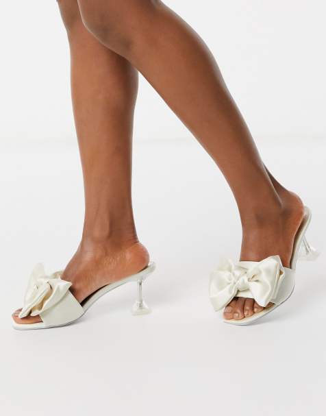 ASOS DESIGN Honesty bow mules with flared heel in ivory - view 1