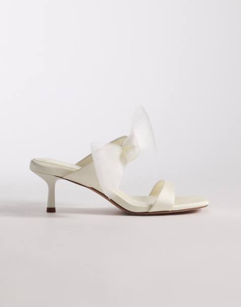 ASOS DESIGN – Honeymoon – Elfenbensvita mules i satin med rosett och halvhög klack - view 1
