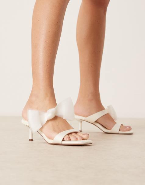ASOS DESIGN – Honeymoon – Satin-Mules in Elfenbein mit mittelhohem Absatz und Schleife - view 1