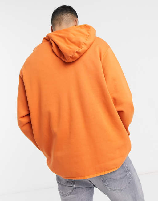 ASOS DESIGN hoodie with half zip and side slit in orange ASOS