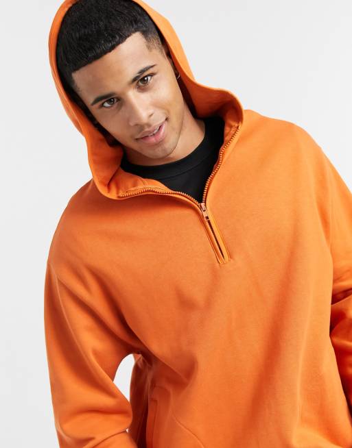 ASOS DESIGN hoodie with half zip and side split in orange