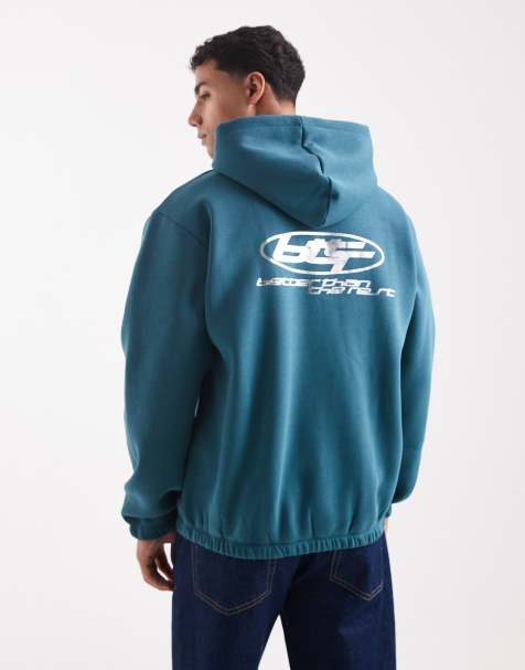 ASOS DESIGN hoodie with metallic athletic print in teal blue - view 1