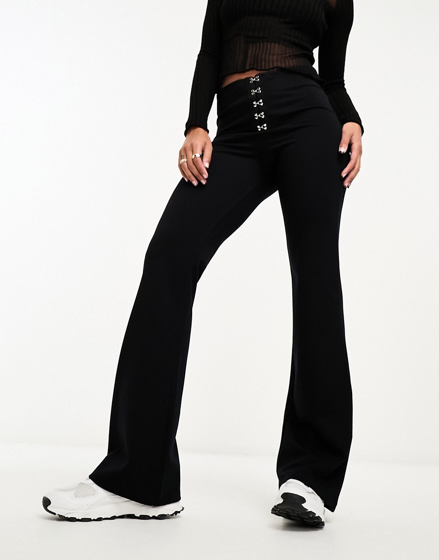 ASOS DESIGN hook and eye detail kick flare trousers in black