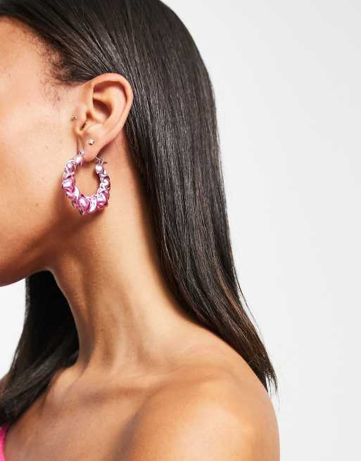 ASOS DESIGN hoop earrings in heart anodised design in pink