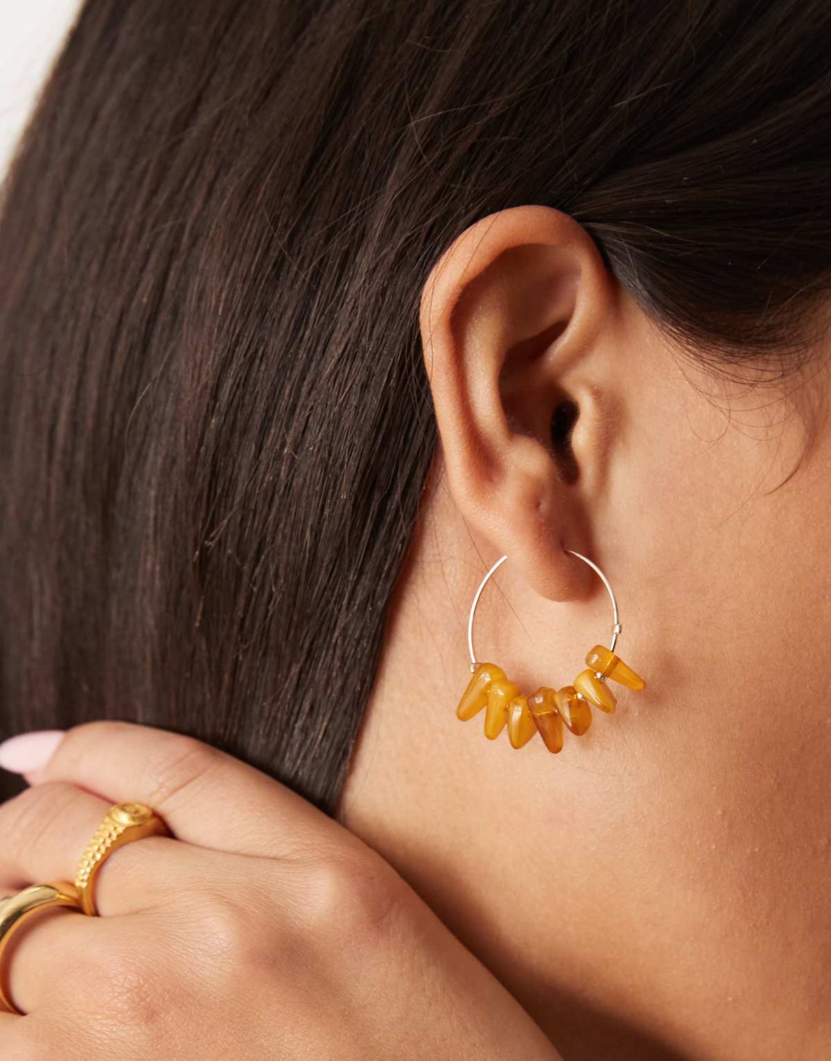 ASOS DESIGN hoop earrings with faux amber stone chippings in gold tone