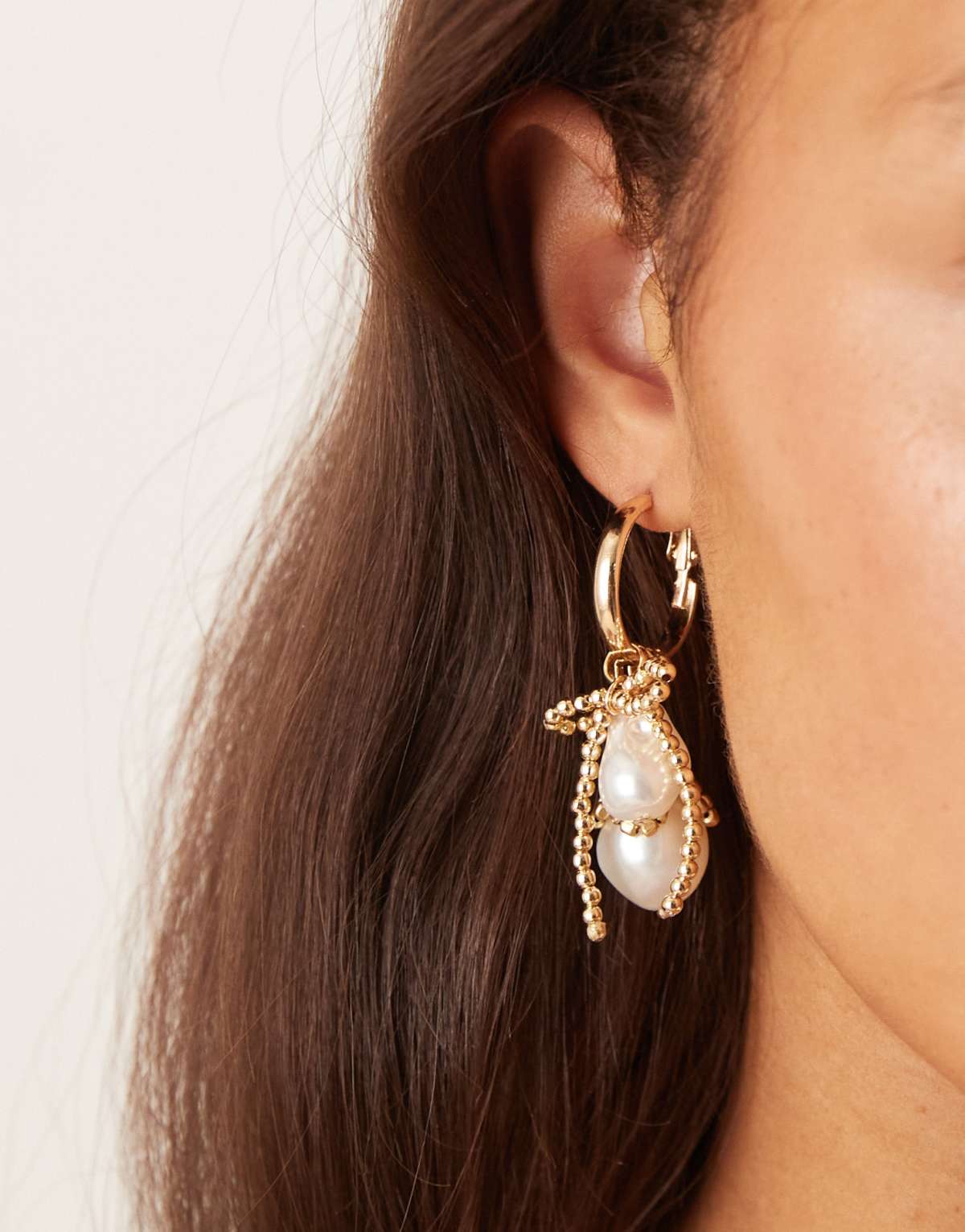 ASOS DESIGN hoop earrings with gold tone tassels and faux pearl drops