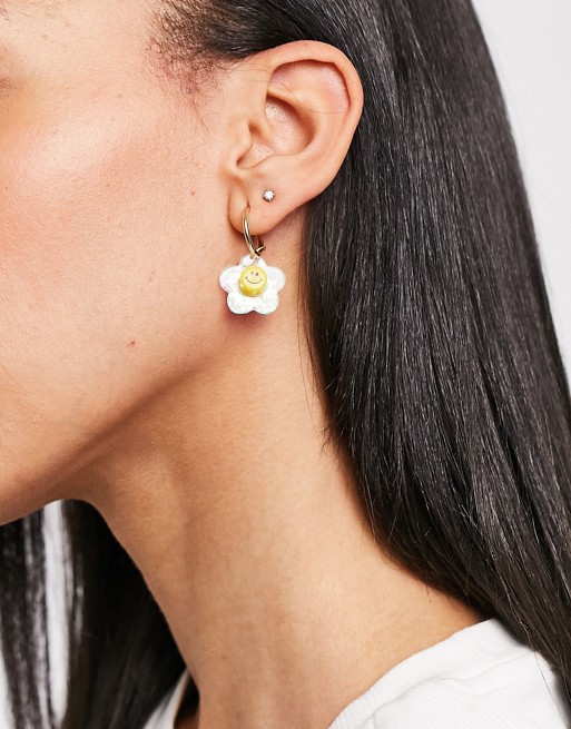 ASOS DESIGN hoop earrings with happy face flower charm in gold tone