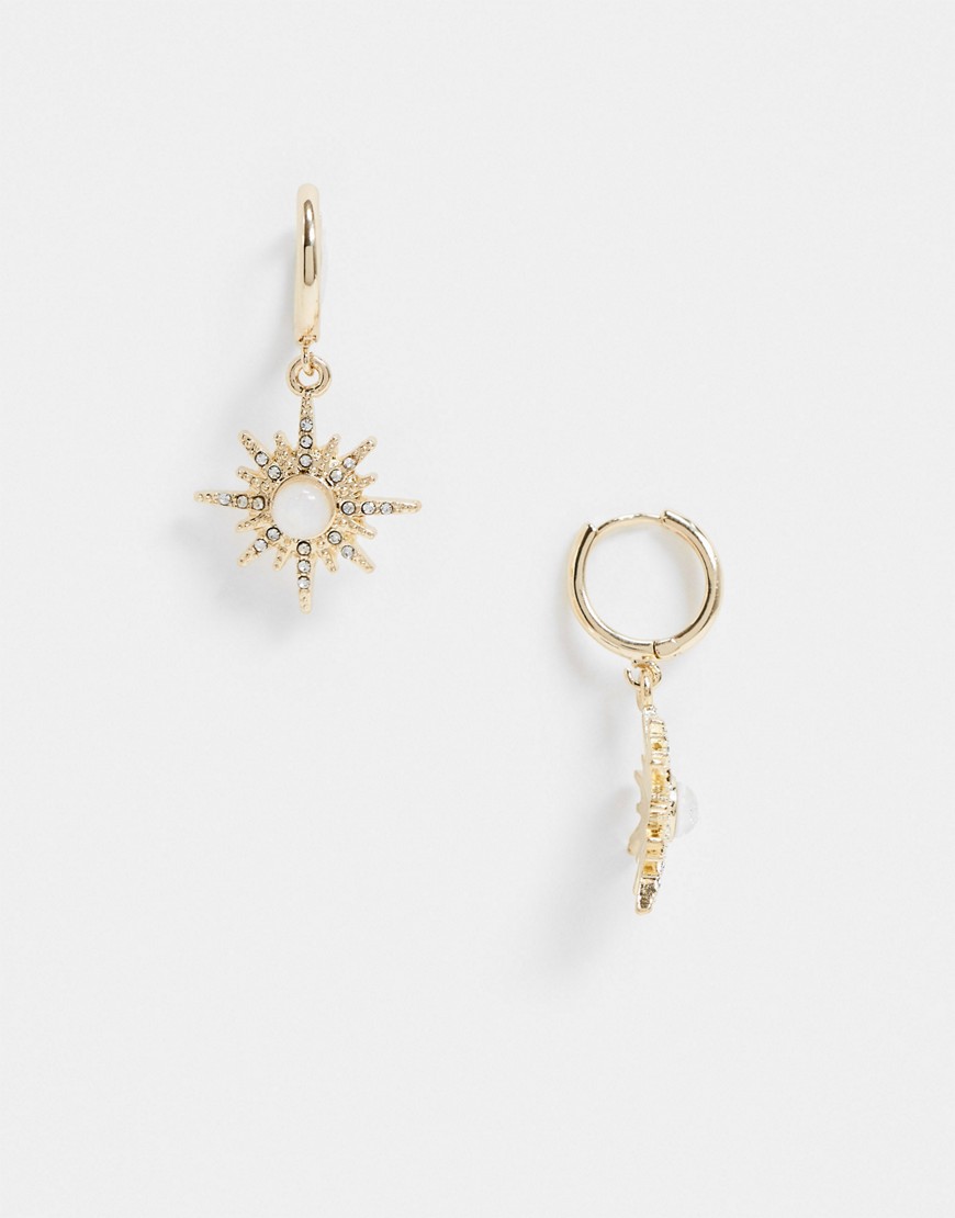 ASOS DESIGN hoop earrings with starburst charm in gold tone