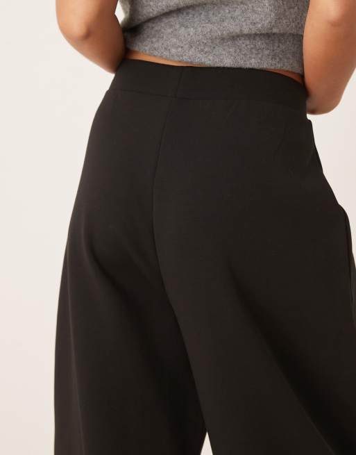 ASOS DESIGN horseshoe barrel leg interlock pants in black