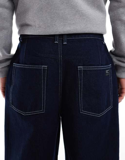 ASOS DESIGN horseshoe jeans in indigo