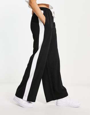 Thumbnail - ASOS DESIGN - Hose zum Hineinschlüpfen mit Kontrastbahn in Schwarz-Braun