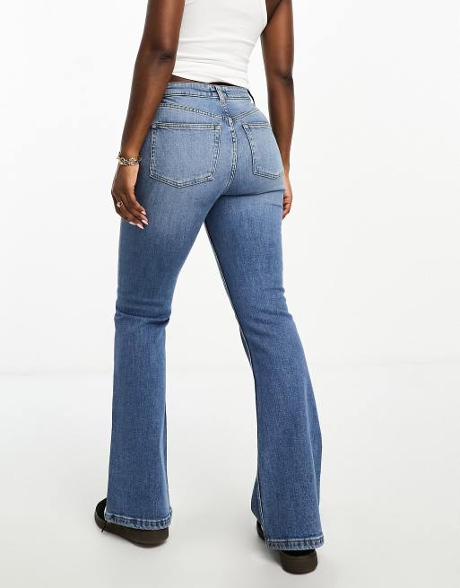 ASOS DESIGN Tall flared jeans in mid blue