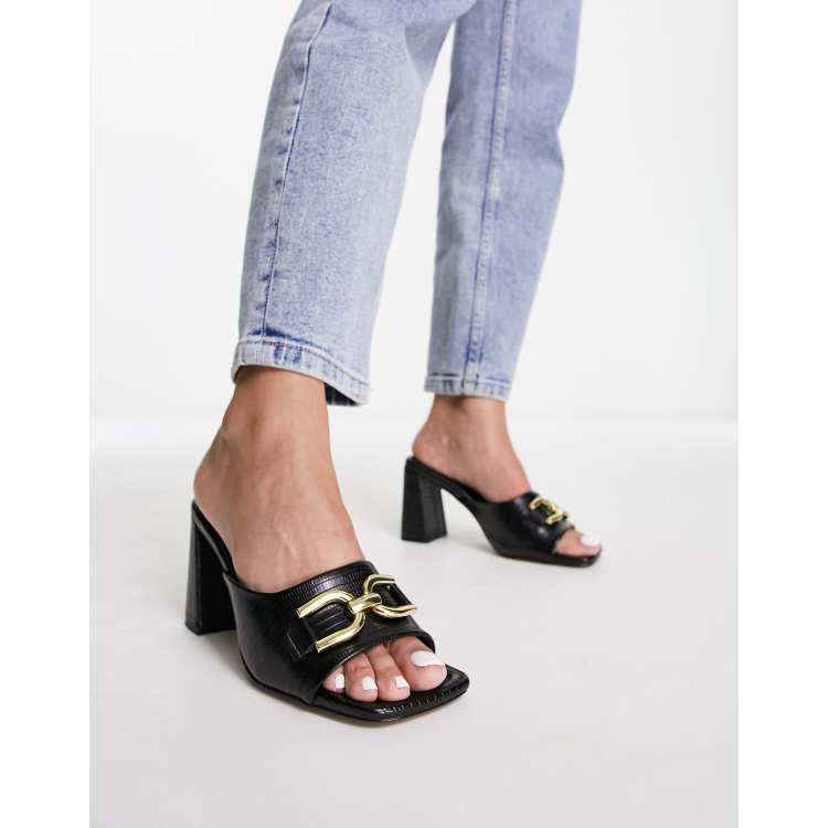 ASOS DESIGN Hush snaffle detail mid heeled mules in black