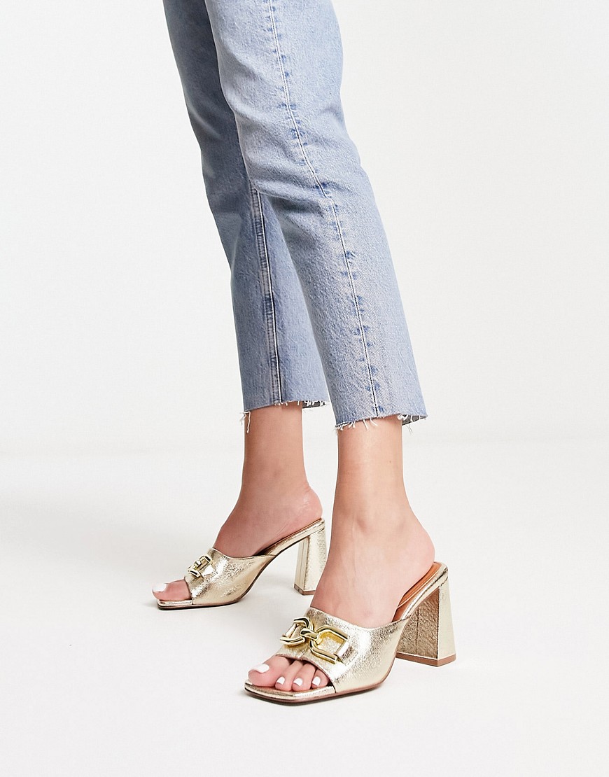ASOS DESIGN Hush snaffle detail mid heeled mules in gold