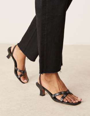 ASOS DESIGN - Hyatt - Mules in Schwarz mit Ösendetail, Schlangenmuster und mittelhohem Absatz