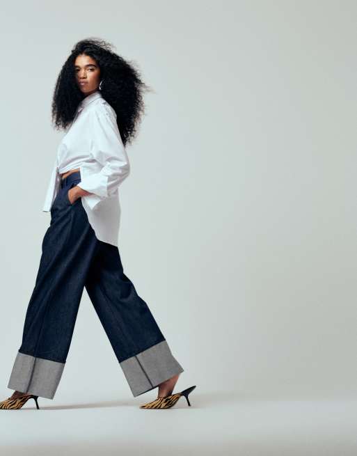 ASOS DESIGN - Iconic - Jeans sartoriali a fondo ampio color indaco con risvolto