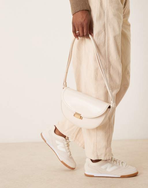 ASOS DESIGN interchangeable curved shoulder and crossbody bag with lock detail in white, 3 of 4