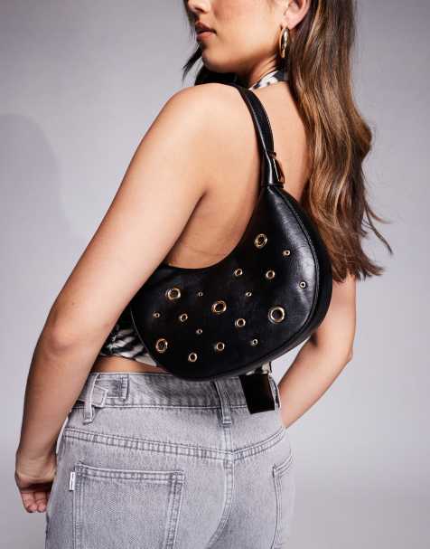 ASOS DESIGN interchangeable shoulder and clutch cookie bag with eyelet studs in black - view 1