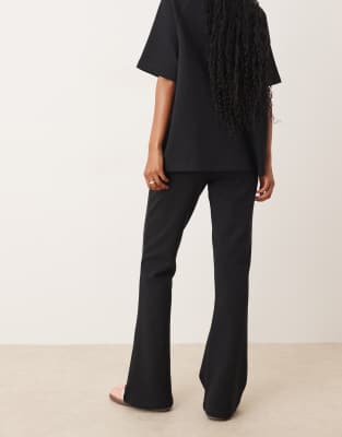 Asos Design Interlock Flared Sweatpants In Black