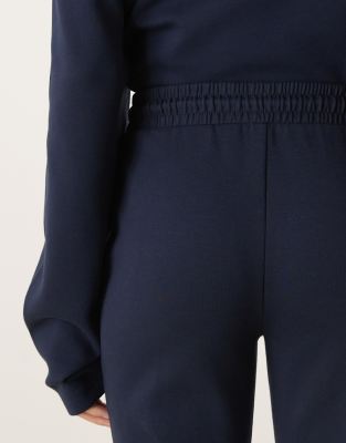 Asos Design Interlock Flared Sweatpants In Blue