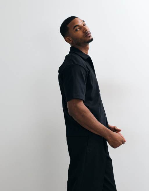ASOS DESIGN Interlock relaxed boxy polo with zip up in black, 2 of 5