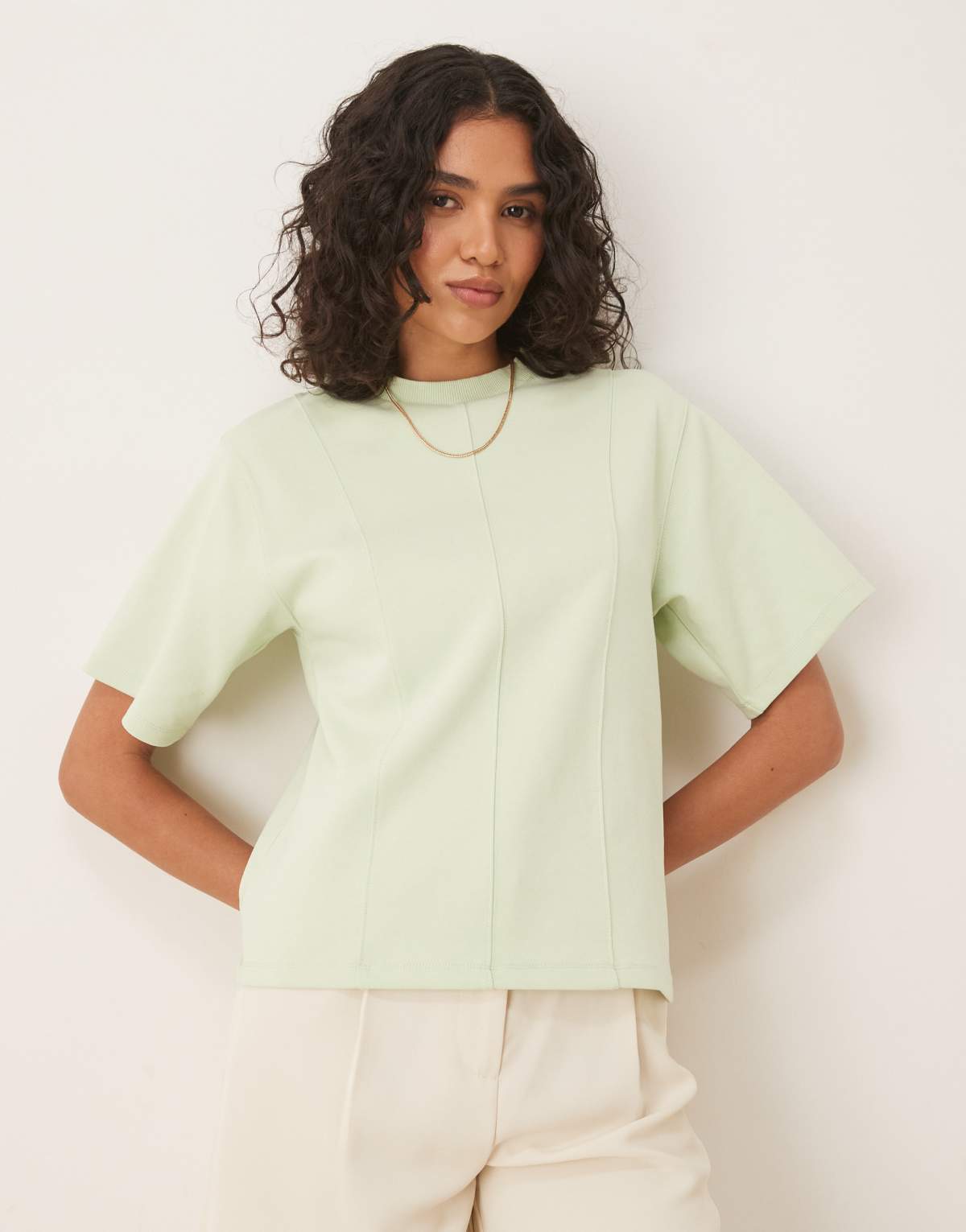 ASOS DESIGN interlock short sleeve top with seam and top stitch detail in pastel green