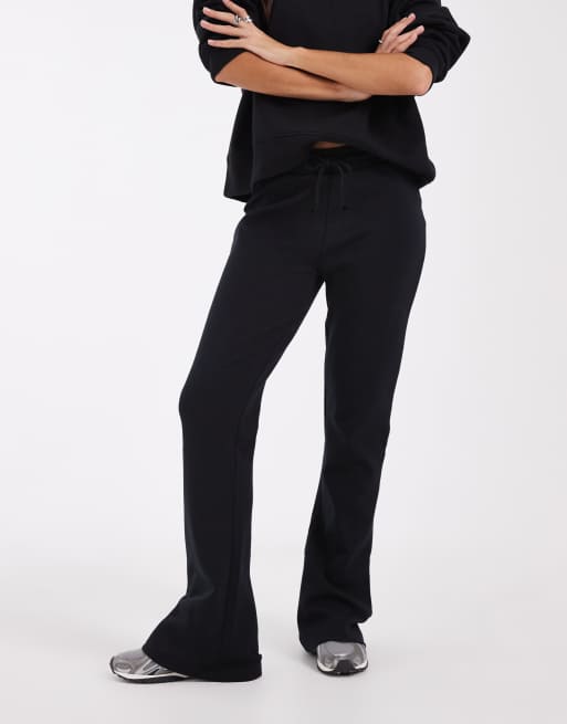 ASOS DESIGN Interlock wide leg flare trackies in black, 2 of 5
