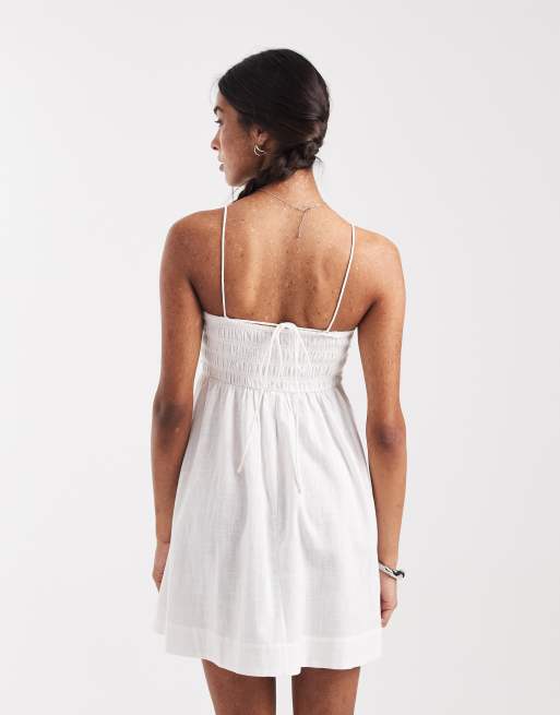 ASOS DESIGN Izzy beach shirred mini sundress with ruffle detail in white, 4 of 4