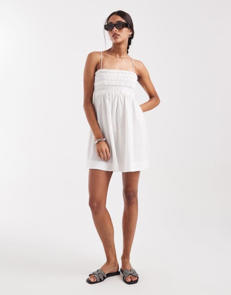 ASOS DESIGN Izzy shirred beach mini sundress with ruffle detailing in white - view 1