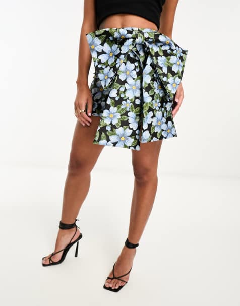 ASOS DESIGN jacquard mini skirt with bow detail in dark blue floral 