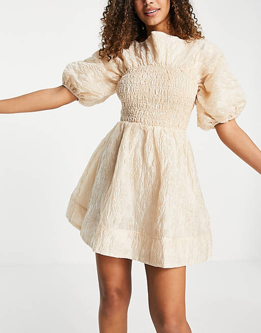  jacquard shirred mini skater dress with bow back and puff sleeves in beige 