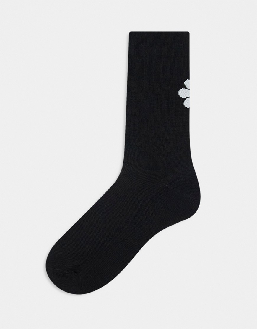 ASOS DESIGN jacquard sock with daisy artwork in black