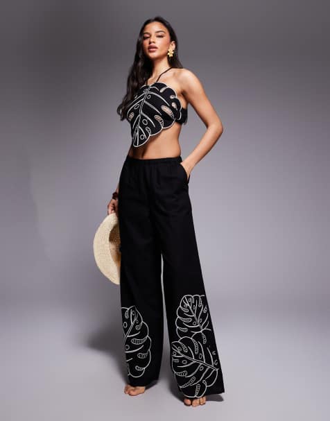 ASOS DESIGN Jasmine Beach tropical cut-out pants in black - view 1