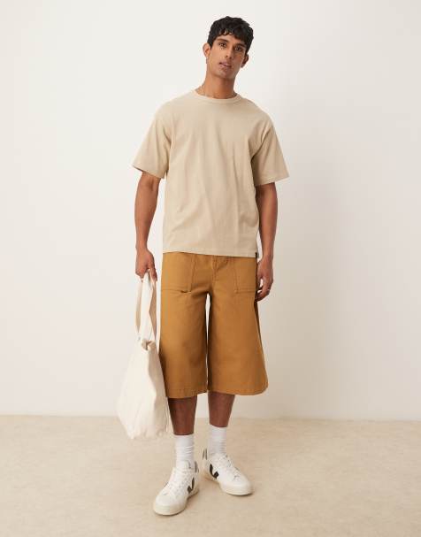 ASOS DESIGN longer length shorts with embroidered back pockets in tan
