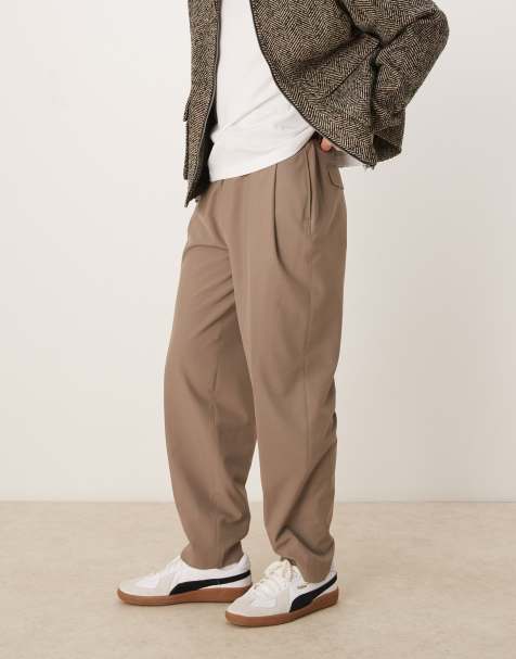 ASOS DESIGN – Jasnobrązowe eleganckie spodnie oversize o zwężanym kroju z głębokimi zakładkami - view 1