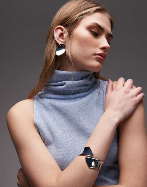 ASOS DESIGN – Jasnoniebieski dzianinowy top bez rękawów z golfem o brokatowym wykończeniu - view 1