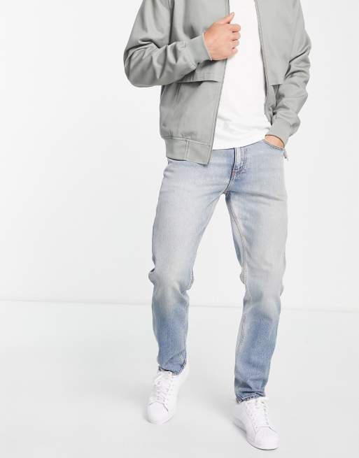 ASOS DESIGN – Jasnoniebieskie dopasowane jeansy z dużymi przetarciami