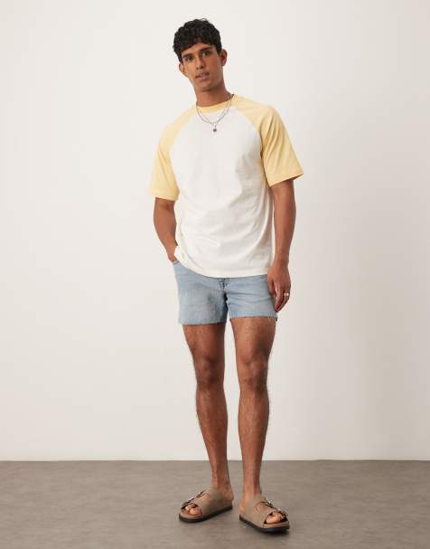 ASOS DESIGN shorter length slim denim shorts with rip detail in light wash blue