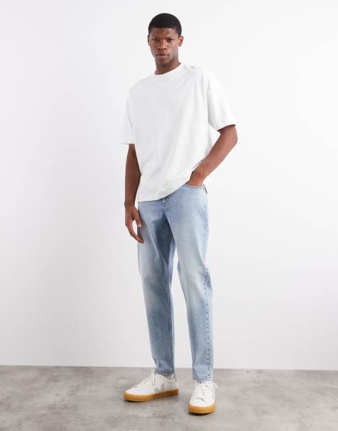 ASOS DESIGN stretch tapered jeans in light wash blue wash