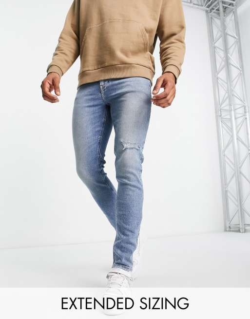 ASOS DESIGN – Jasnoniebieskie jeansy o obcisłym kroju z rozdarciami