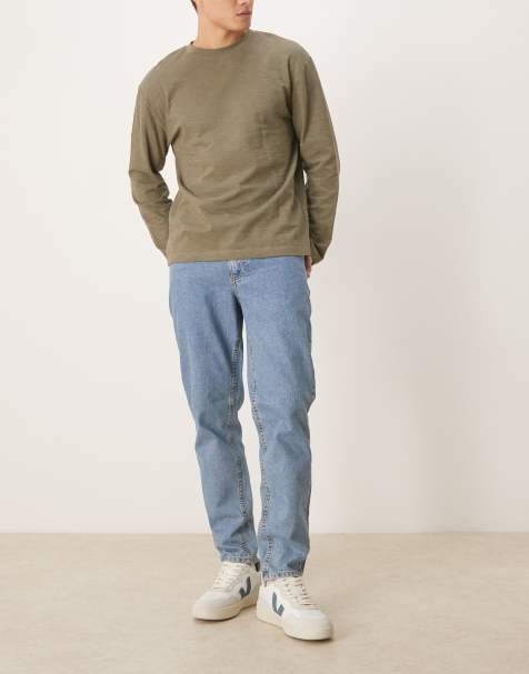 ASOS DESIGN tapered fit jeans in light wash blue 