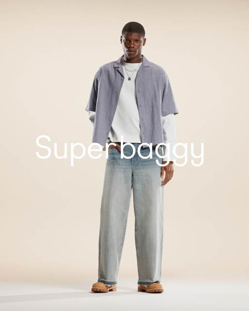 ASOS DESIGN – Jasnoniebieskie sprane jeansy o bardzo luźnym kroju z efektem fioletowego odbarwienia