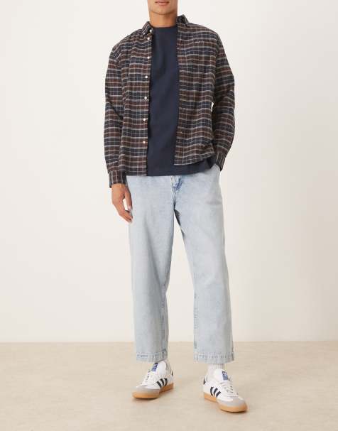 ASOS DESIGN relaxed tapered pleated jeans in bleach wash denim
