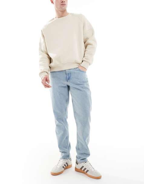 ASOS DESIGN tapered jeans in light stone wash blue